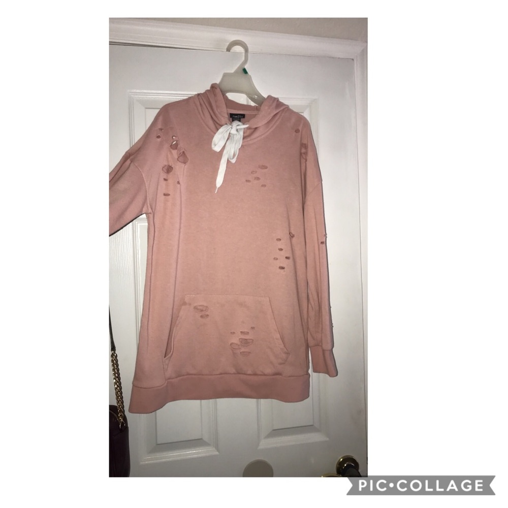 A pink distressed hoodie